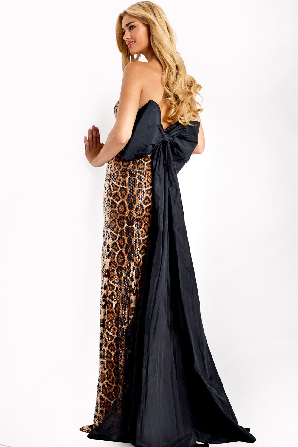 Jovani 48651 Animal print prom dress with a fitted silhouette and dramatic bow detail at the back.