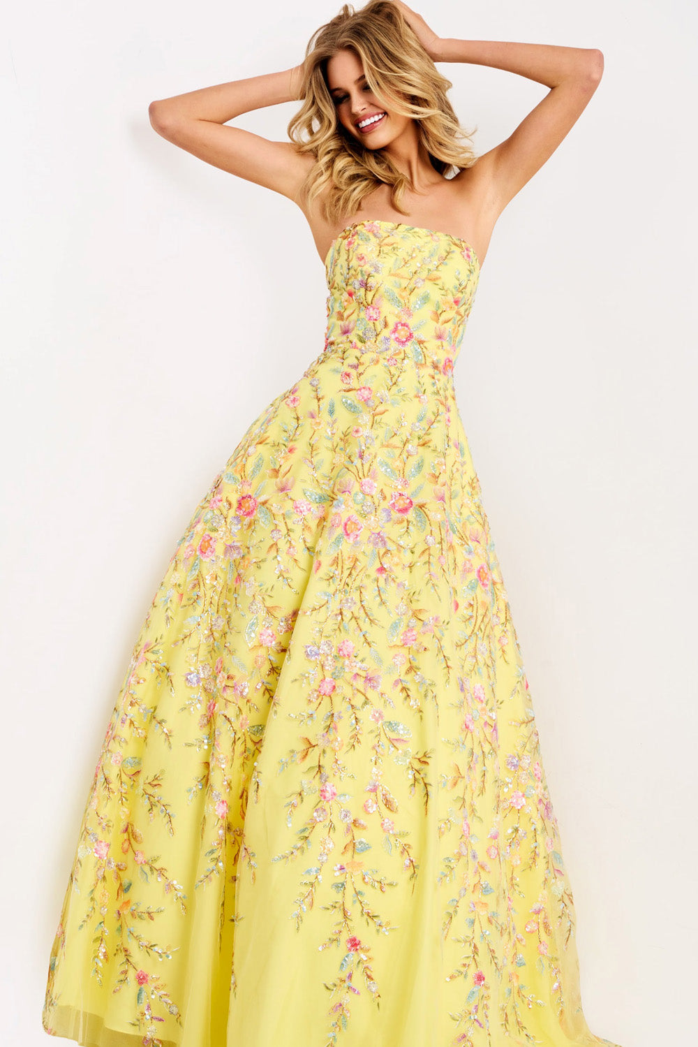 Jovani 49070 Yellow A-line prom dress with floral embroidery and strapless design.
