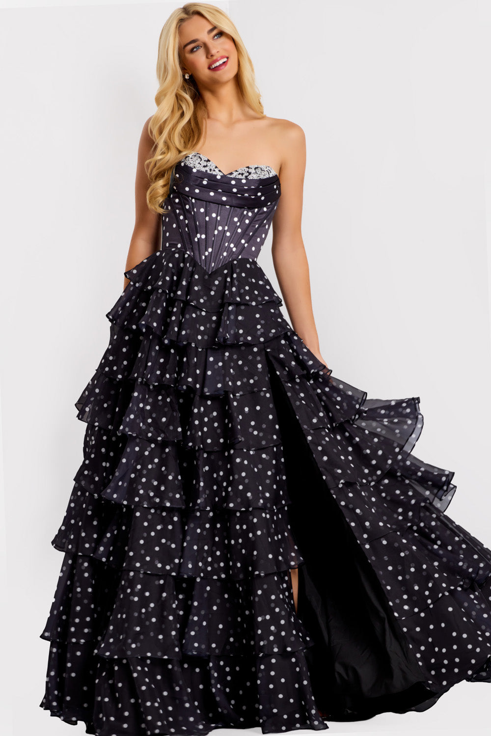 Jovani 49087 Black tiered prom dress with a high slit and beaded sweetheart neckline.