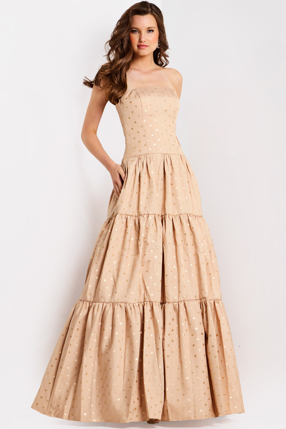 Jovani 49341 Beige formal gown with tiered skirt and gold polka dots, front view.