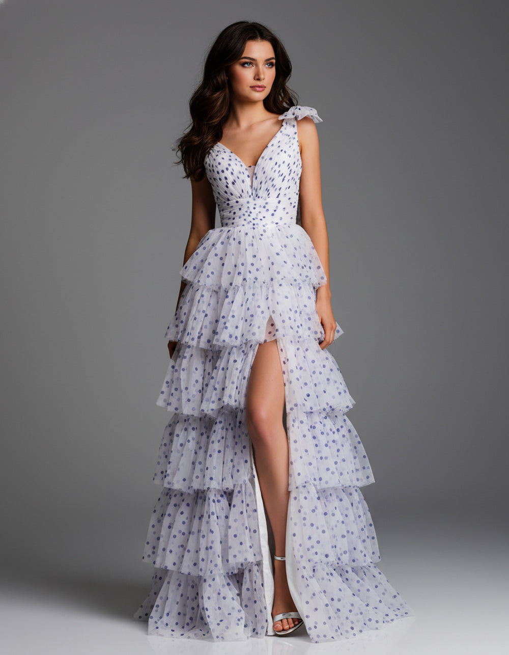 Jovani 49358 Off white and purple tiered prom dress with a thigh-high slit, front view.