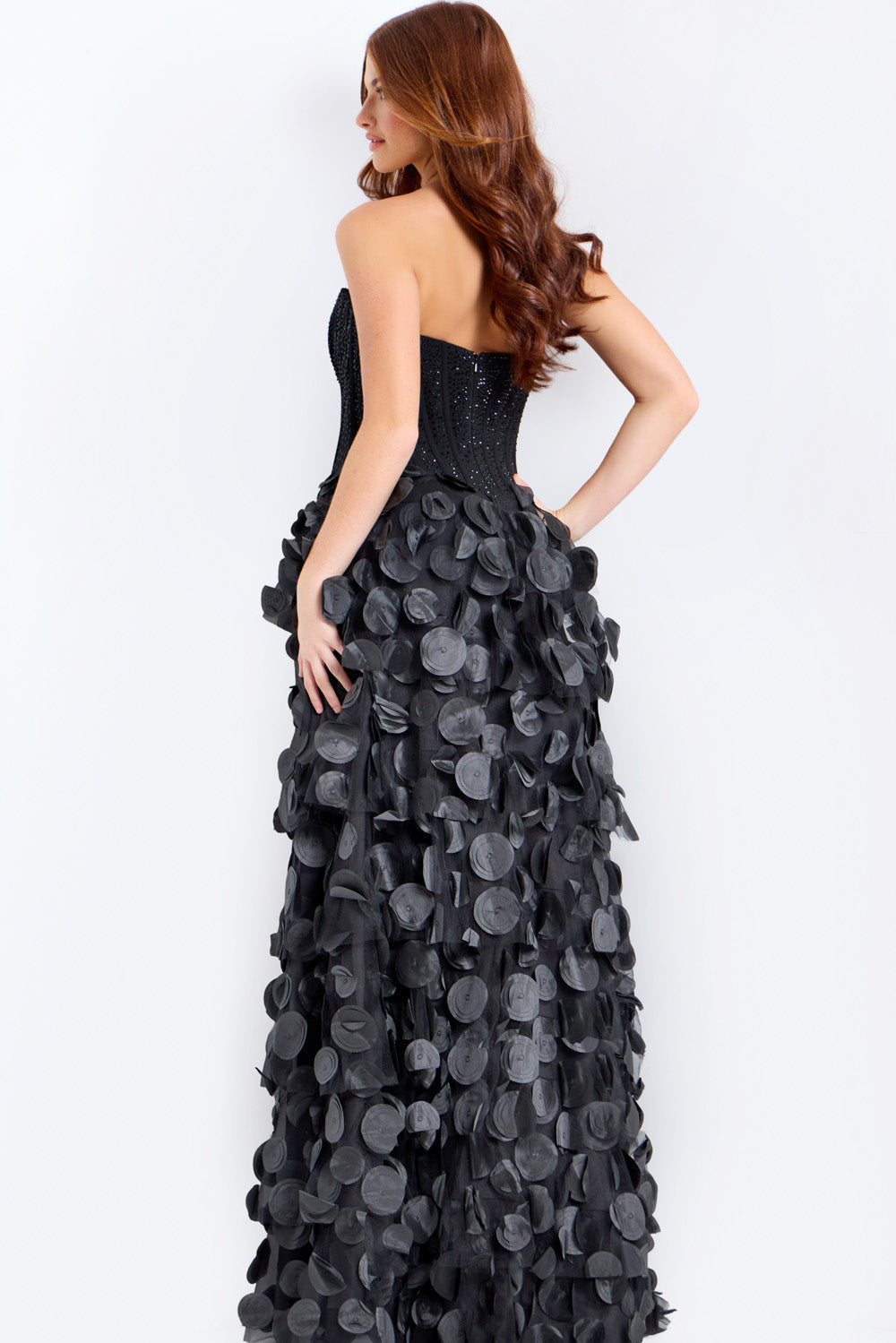 Jovani 49384 Black mermaid prom dress with beaded bodice and layered ruffle skirt, back view.