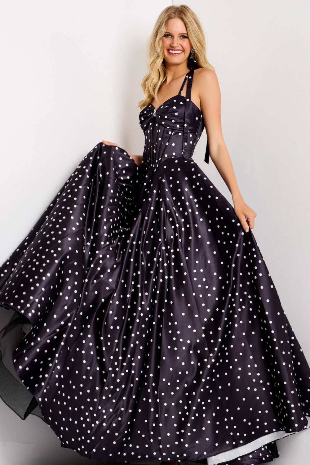 Jovani 49774 Navy prom dress with polka dots, fitted bodice, and flowing A-line skirt.