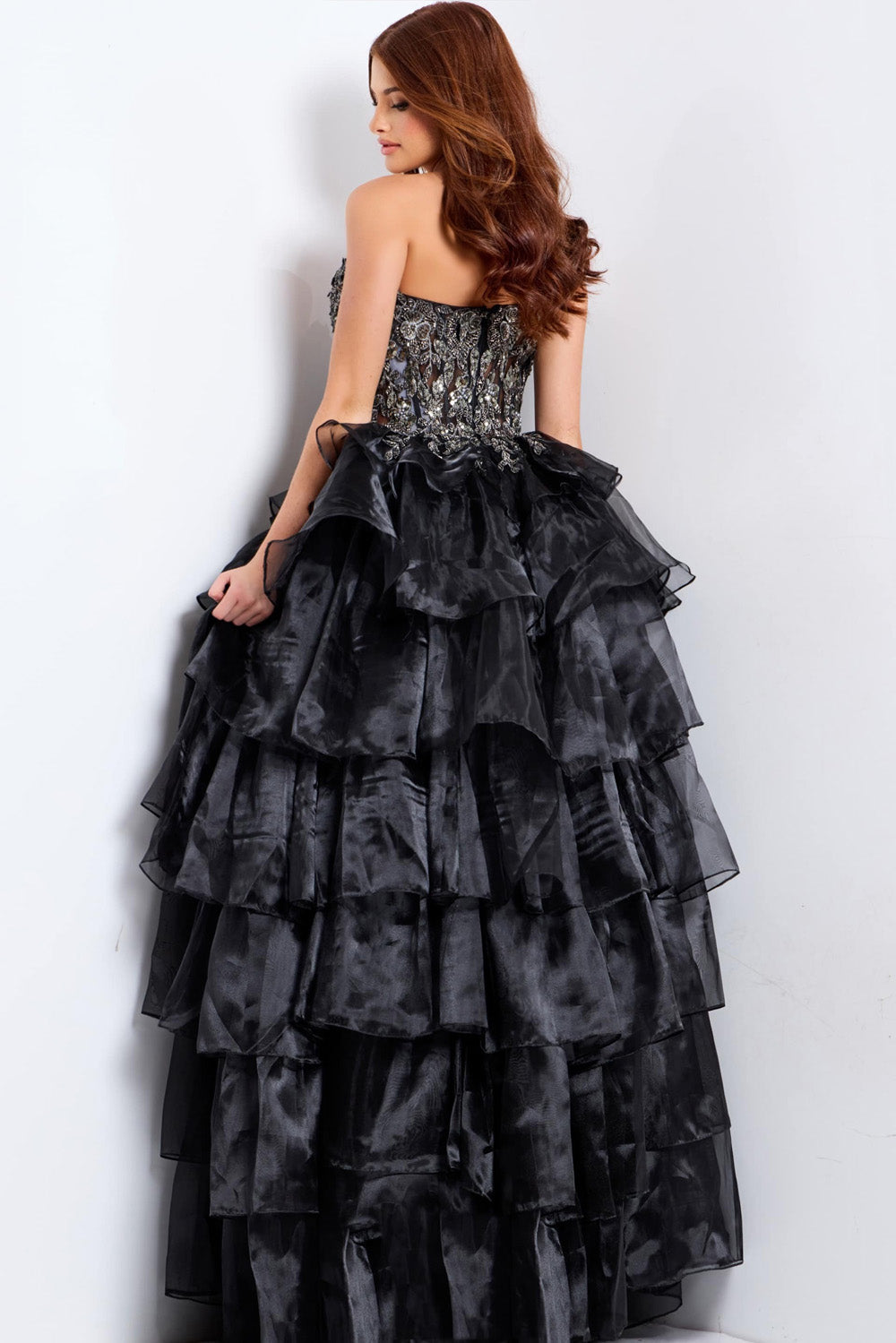 Jovani 50259 Black ballgown prom dress with tiered ruffles and intricate beading, back view.