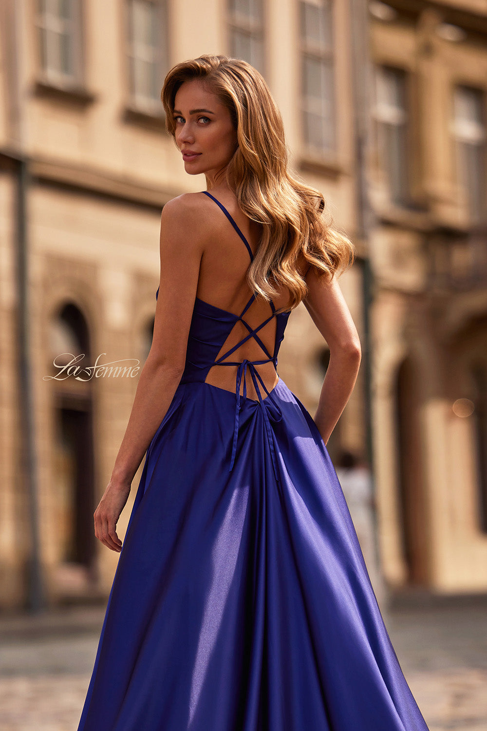 La Femme 33373 Indigo A-line prom dress with a lace-up back and flowing satin fabric.
