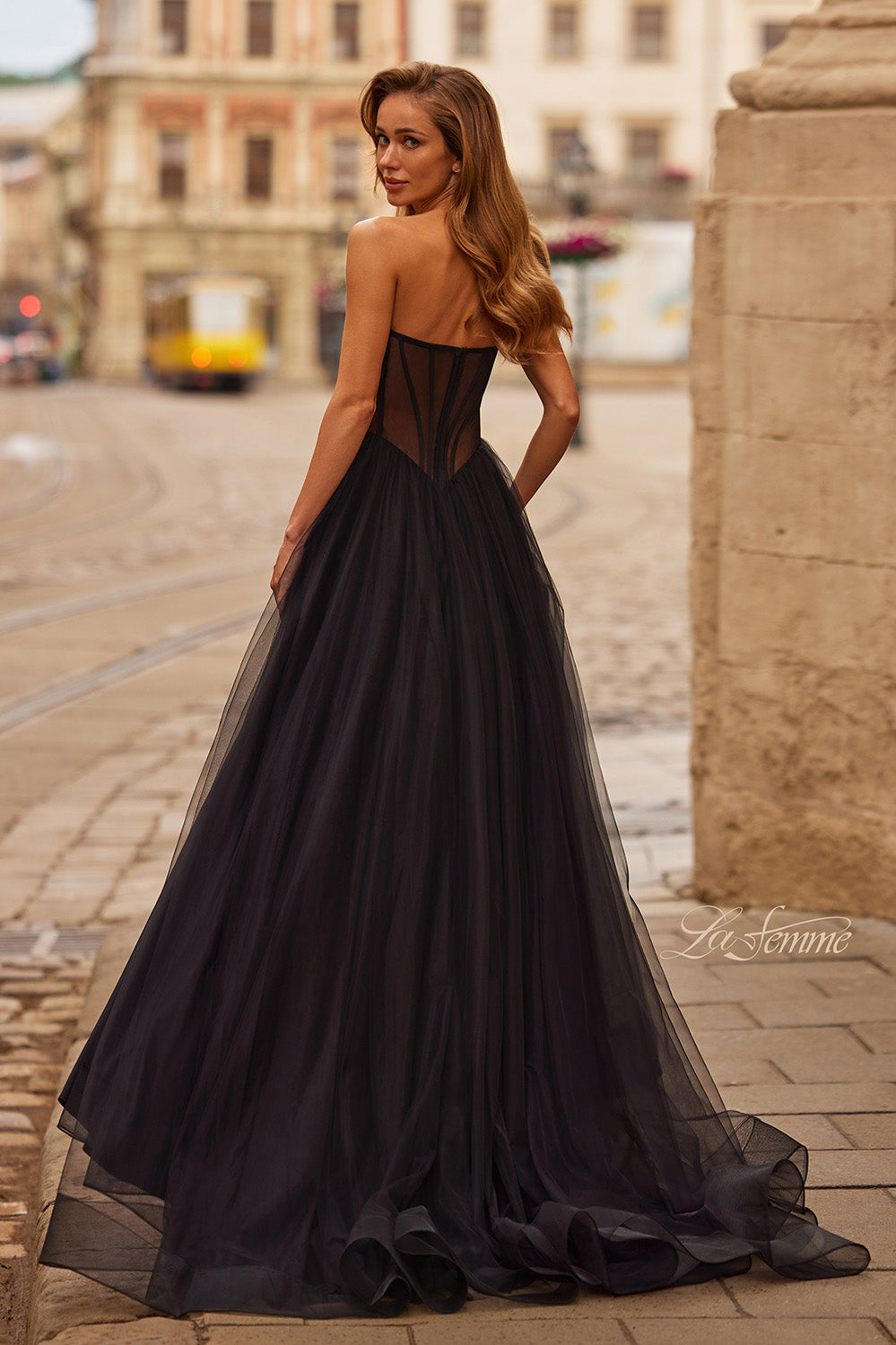 La Femme 33491 Black A-line prom dress with lace-up back and flowing tulle skirt, back view.