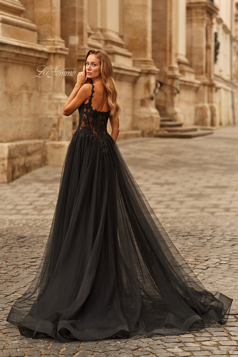 La Femme 33499 Black lace tulle prom dress with a flowing skirt and intricate back detailing.