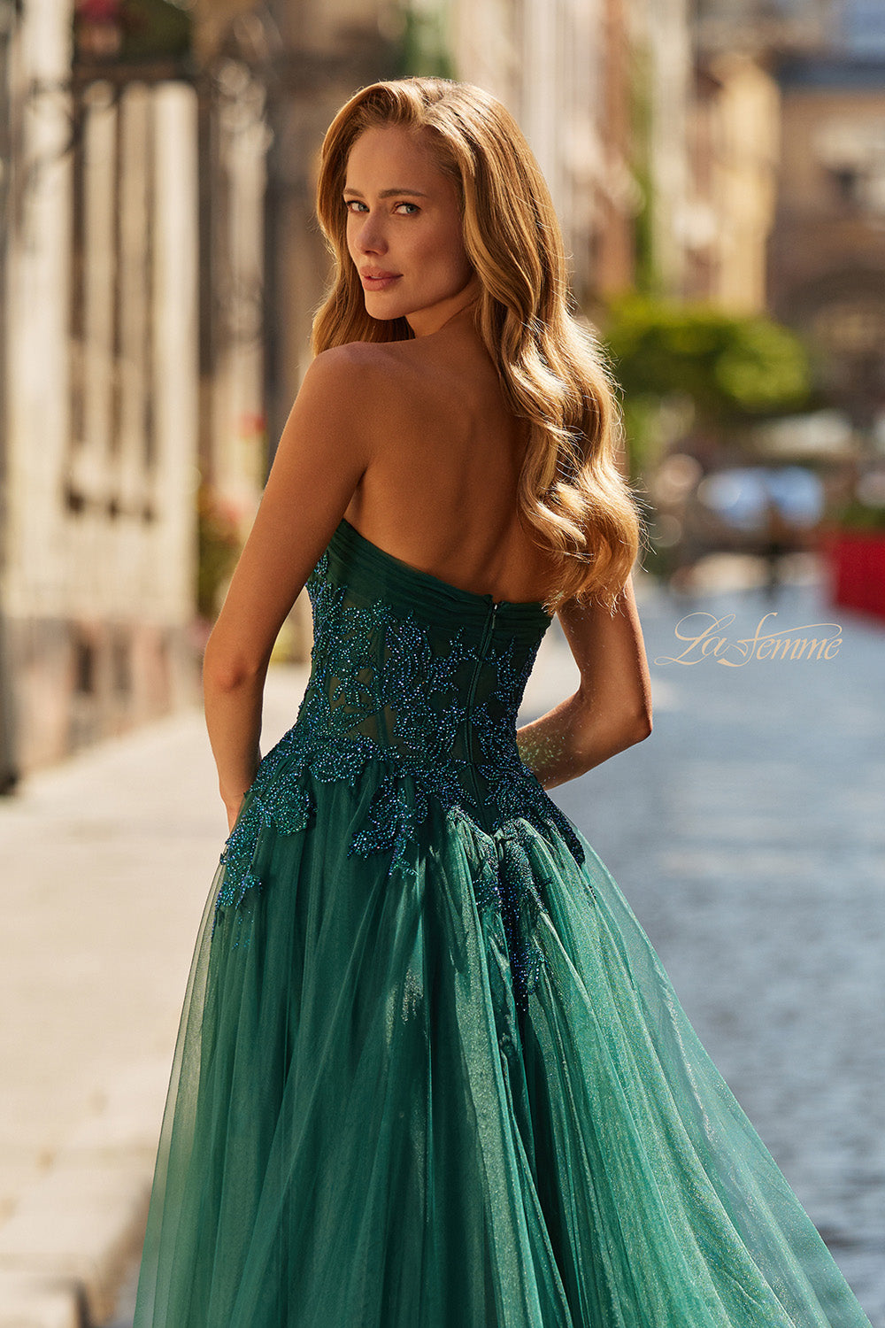 La Femme 33528 Dark emerald prom dress with lace detailing and a fitted bodice, back view.