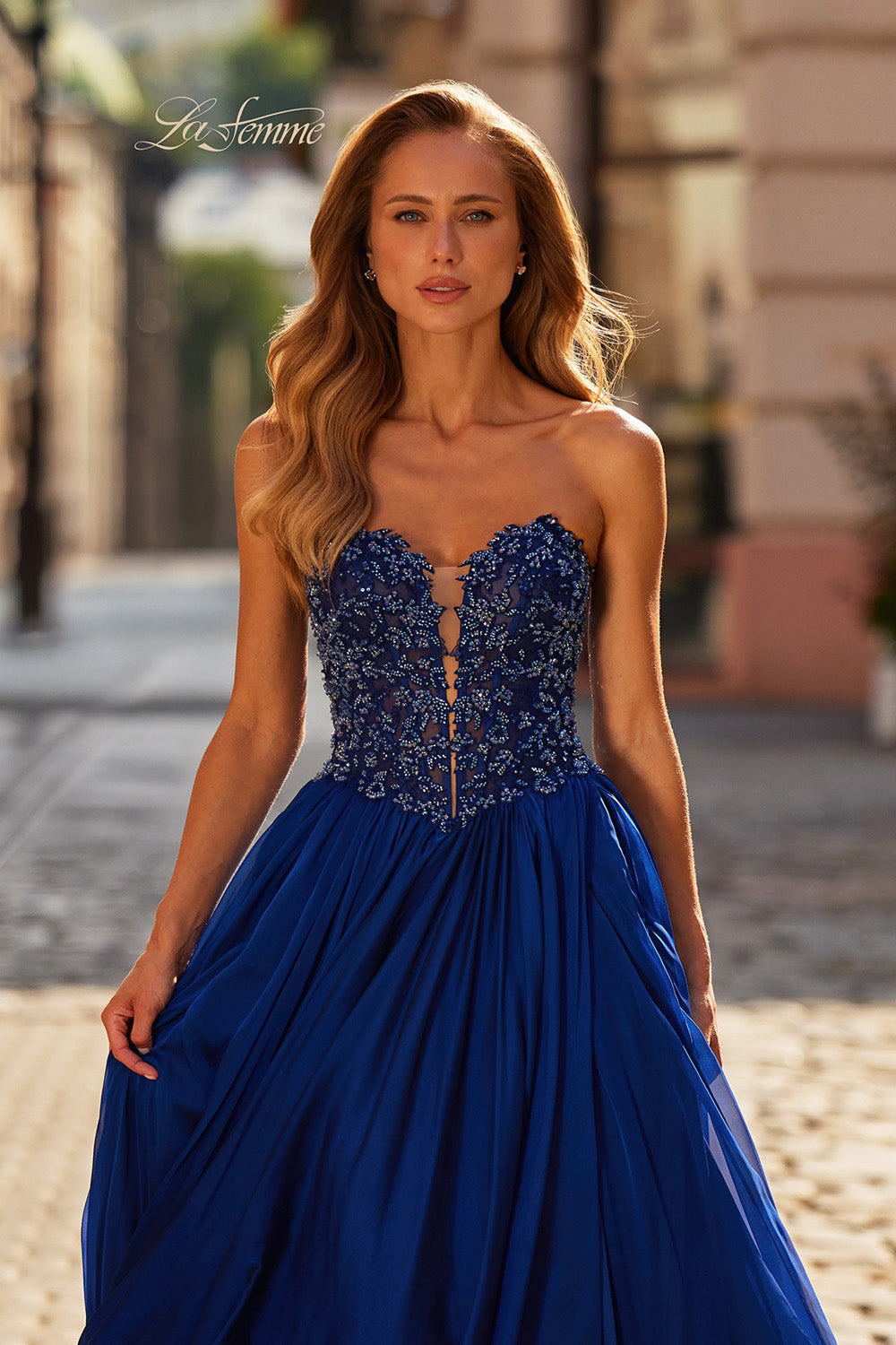 La Femme 33552 Marine blue prom dress with beaded bodice and flowing A-line silhouette.