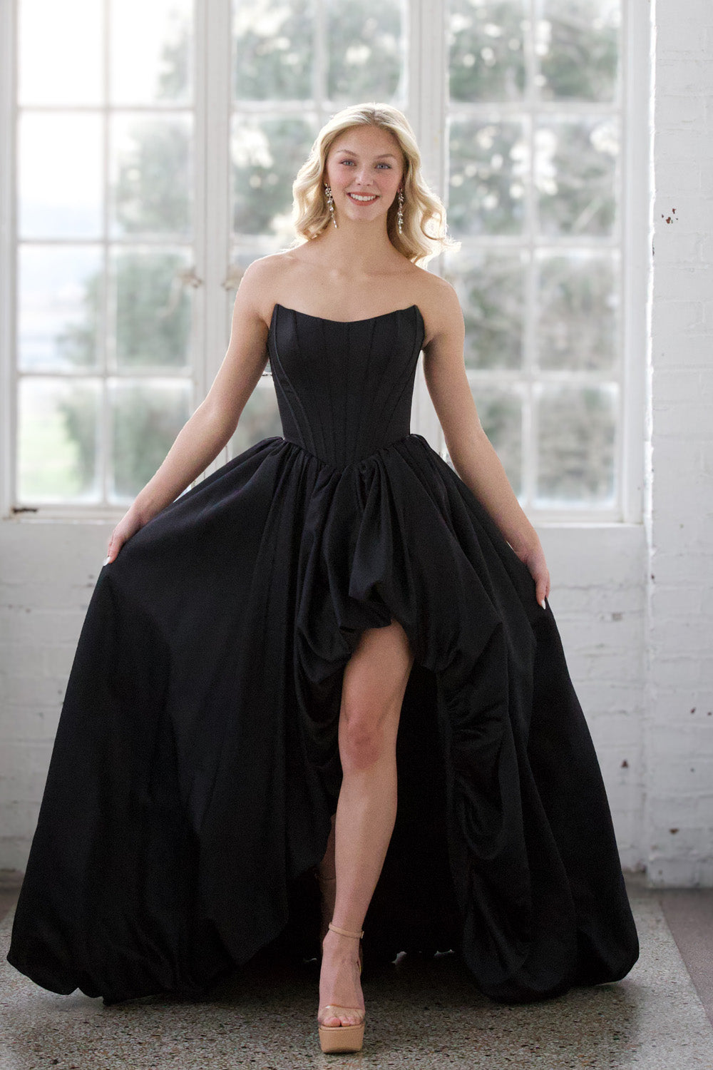 Miah Vega 24601 Black mermaid prom dress with a high slit and strapless sweetheart neckline.