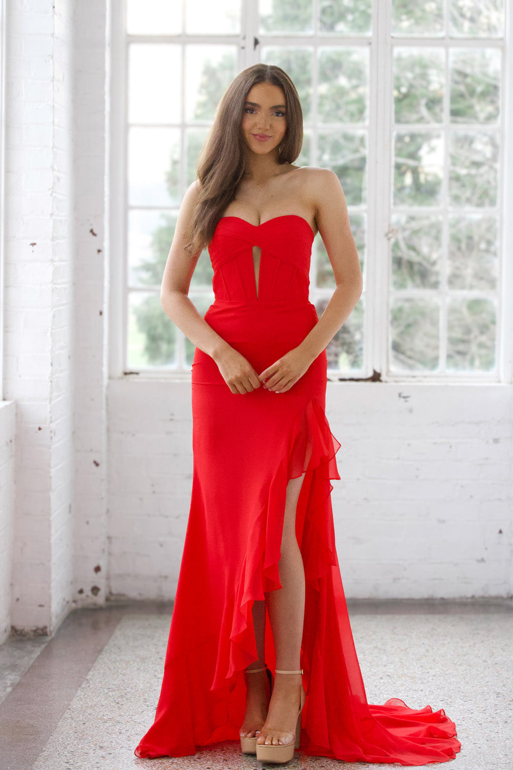 Miah Vega 24603 Red mermaid prom dress with a thigh-high slit and sweetheart neckline, front view.