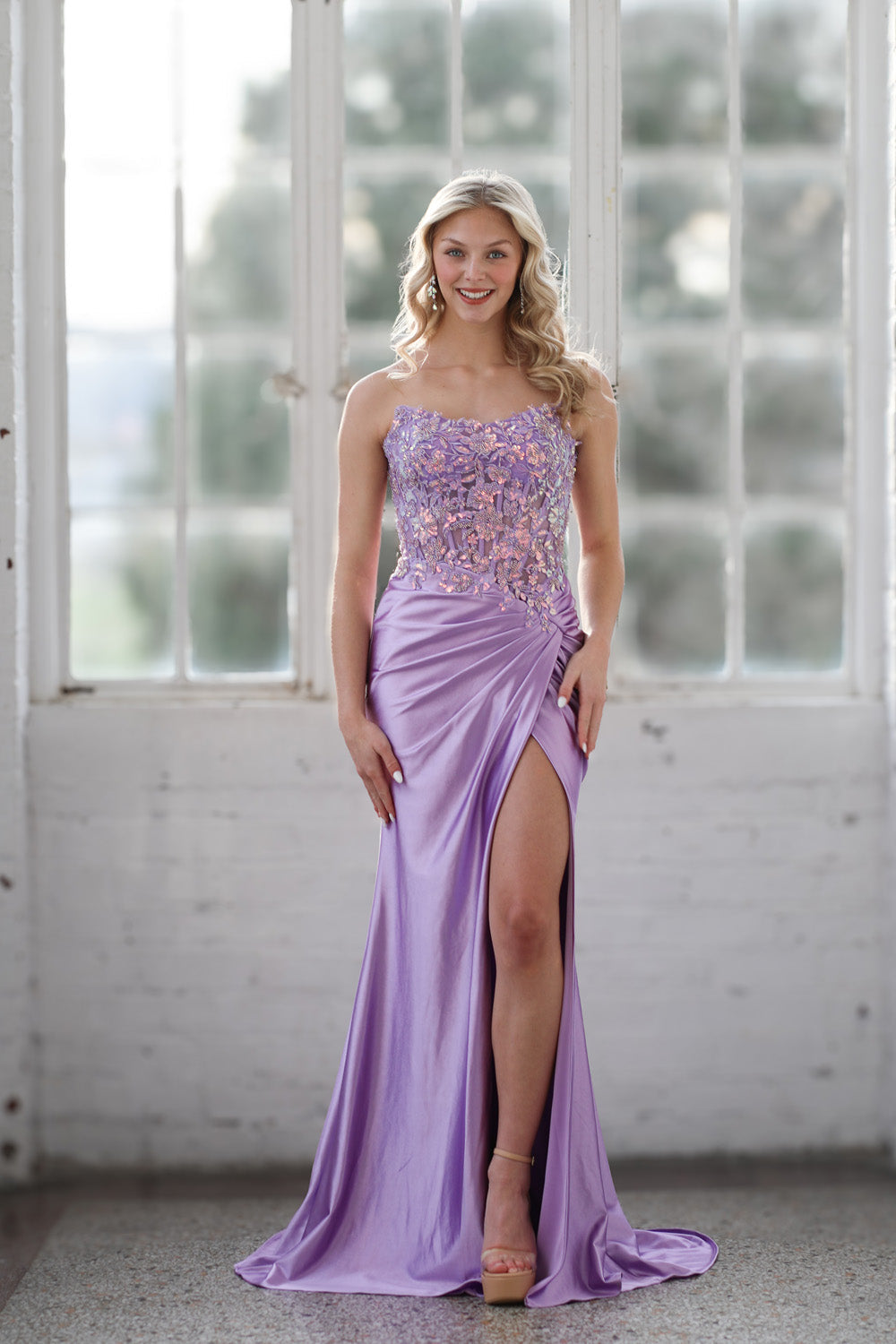 Miah Vega 24607 Lilac prom dress with a fitted silhouette and side slit, featuring intricate beading.
