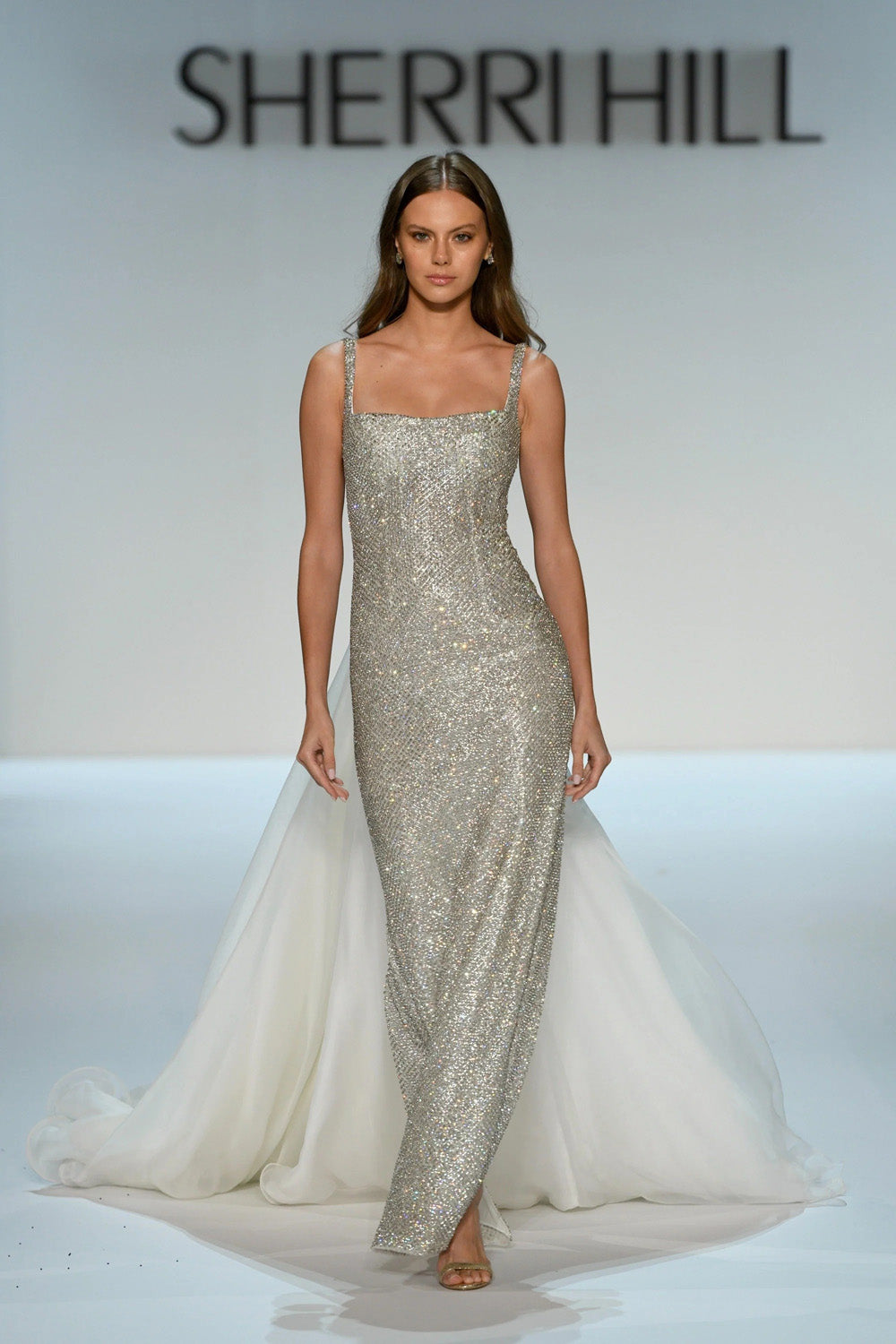 Sherri Hill 46522v ivory black gown open low back with black velvet rosettes anchoring the ivory organza skirt