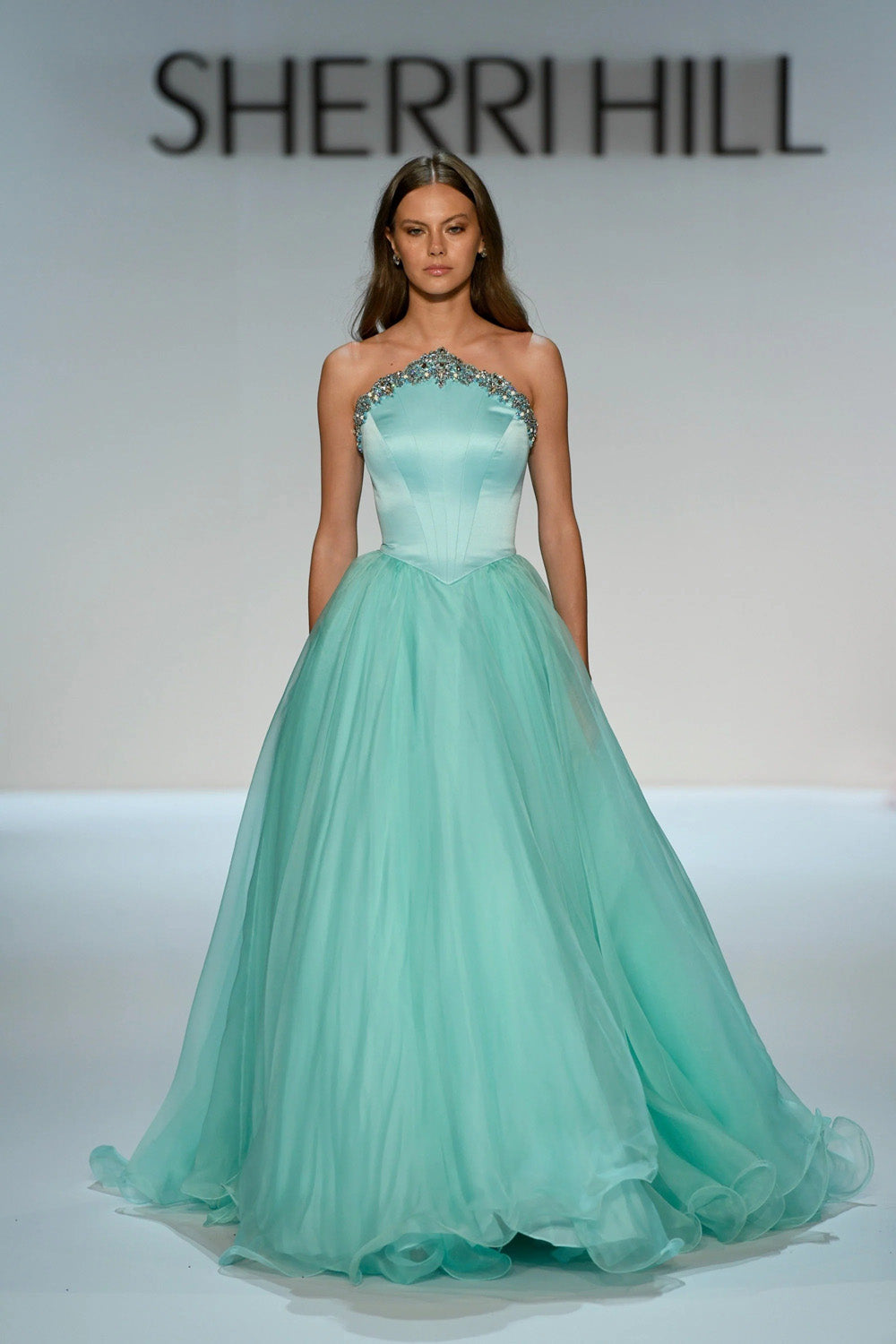 Sherri Hill 46702 seafoam strapless ball gown with beaded neckline border and full chiffon skirt close view