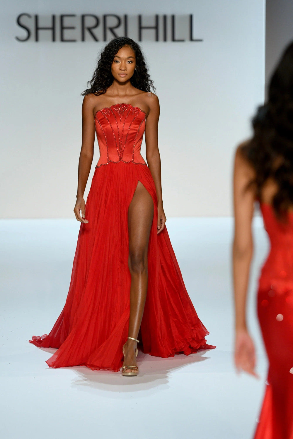 Sherri Hill 46703 red satin corset bodice close up with fan shaped beaded embellishment at sweetheart neckline