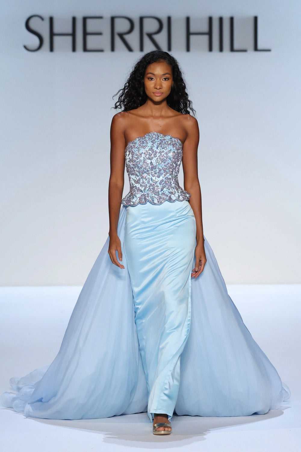Sherri Hill 46706 light blue strapless beaded corset gown with scalloped peplum and full cathedral overskirt train