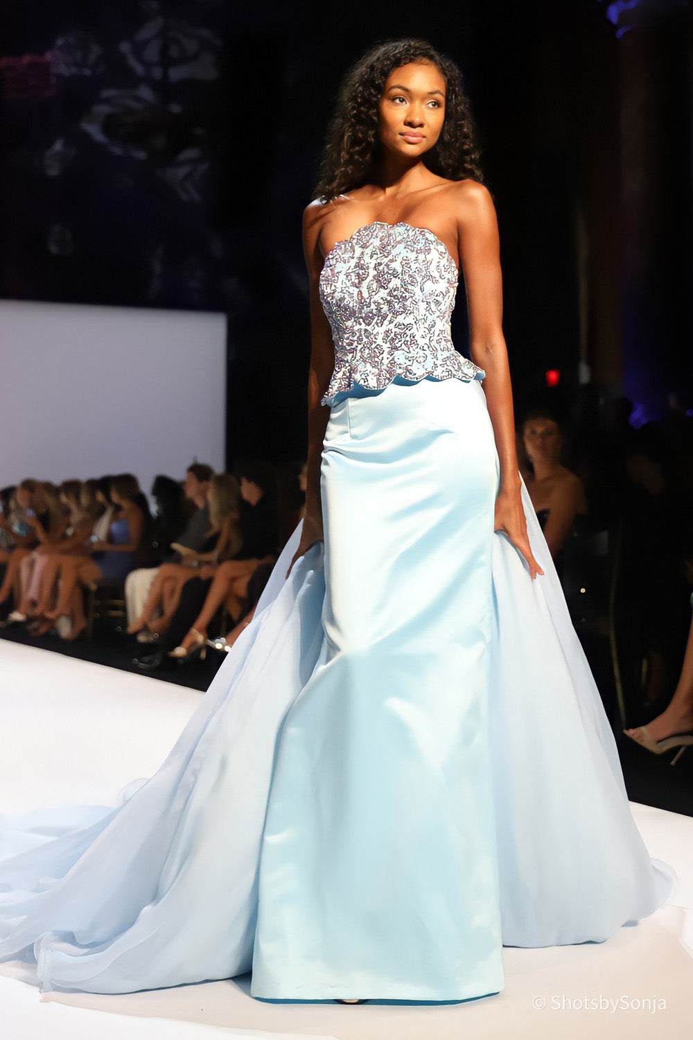 Sherri Hill 46706 light blue couture gown showing beaded corset bodice scalloped peplum and sweeping two layer skirt