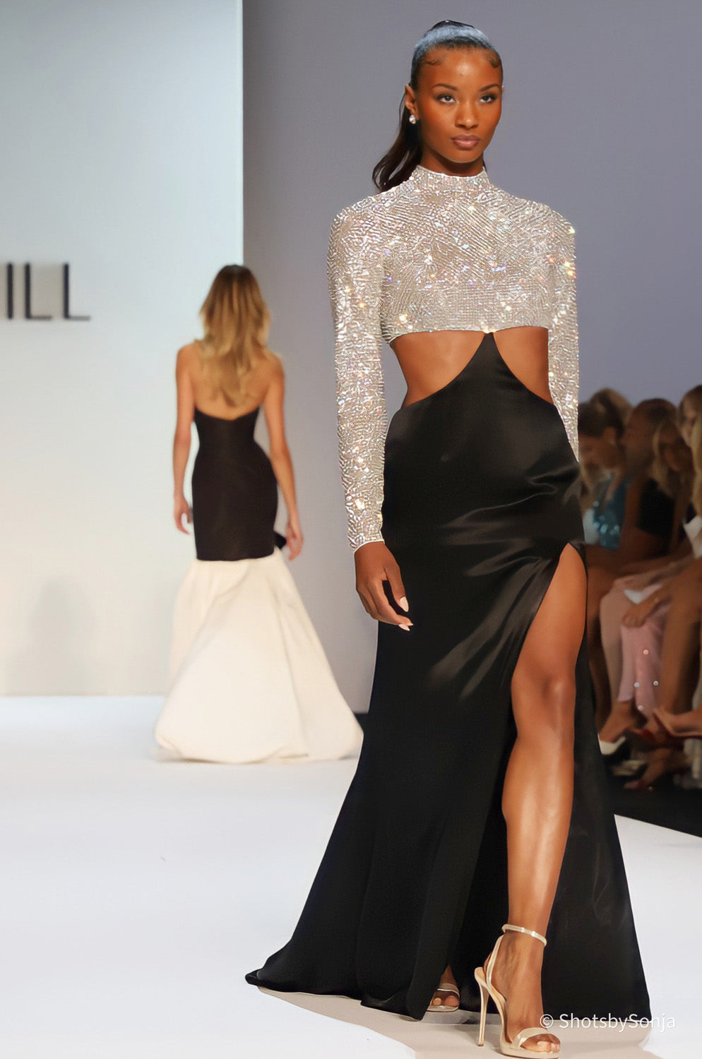 Sherri Hill 46718 black white embellished long sleeve bodice black satin high slit skirt side angle runway view