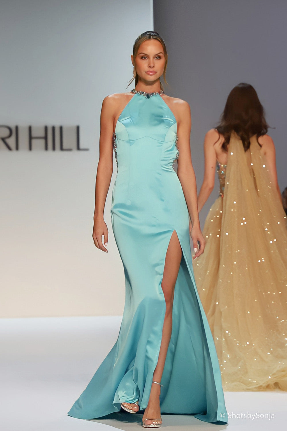 Sherri Hill 46725 aqua gold fitted halter gown with beaded open back walking full length runway view