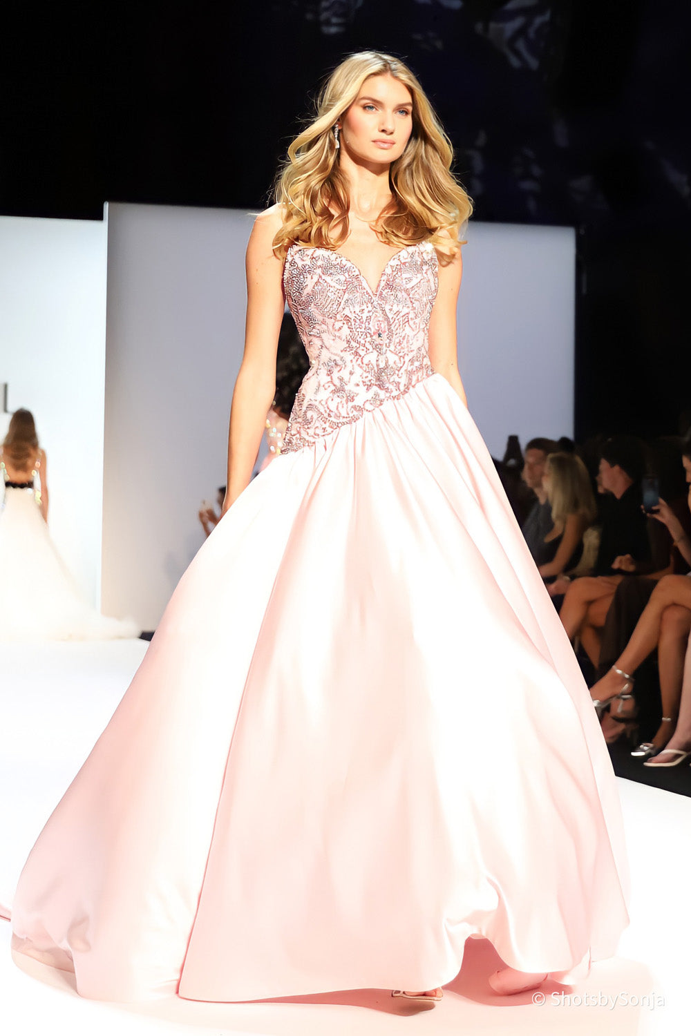 Sherri Hill 46748 blush ballgown showing scrolling beaded bodice tapering into a voluminous satin skirt