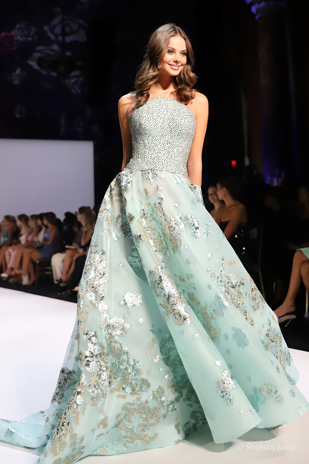 Sherri Hill 46749 aquamarine strapless gown in motion showing metallic floral organza skirt volume and beaded bodice