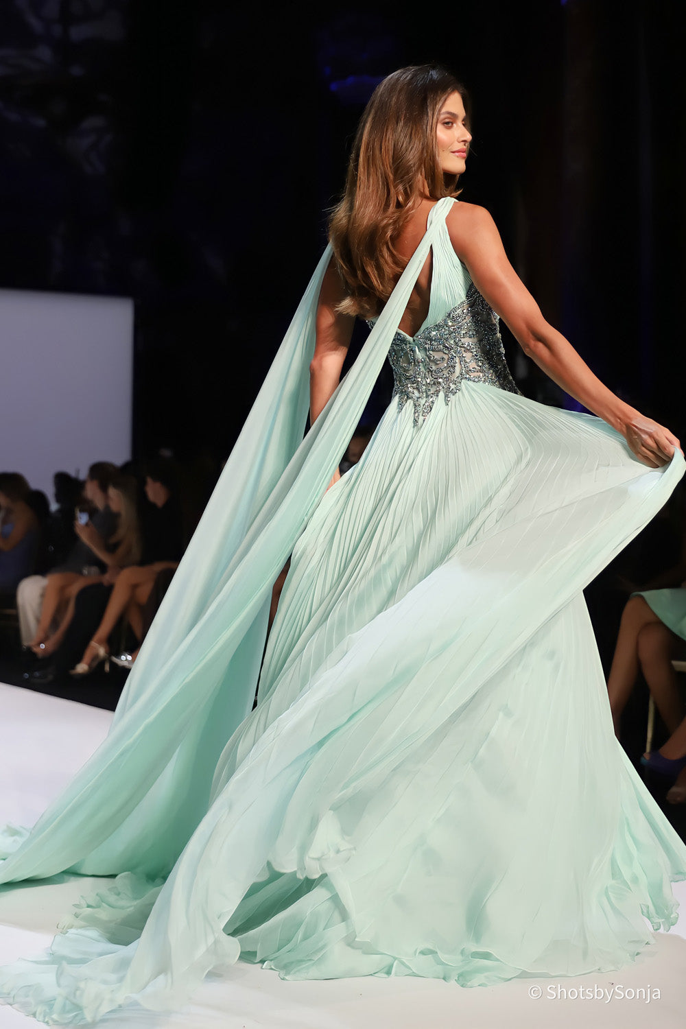 Sherri Hill 46755 mint gown back view showing open back and long trailing cape panels from shoulder straps
