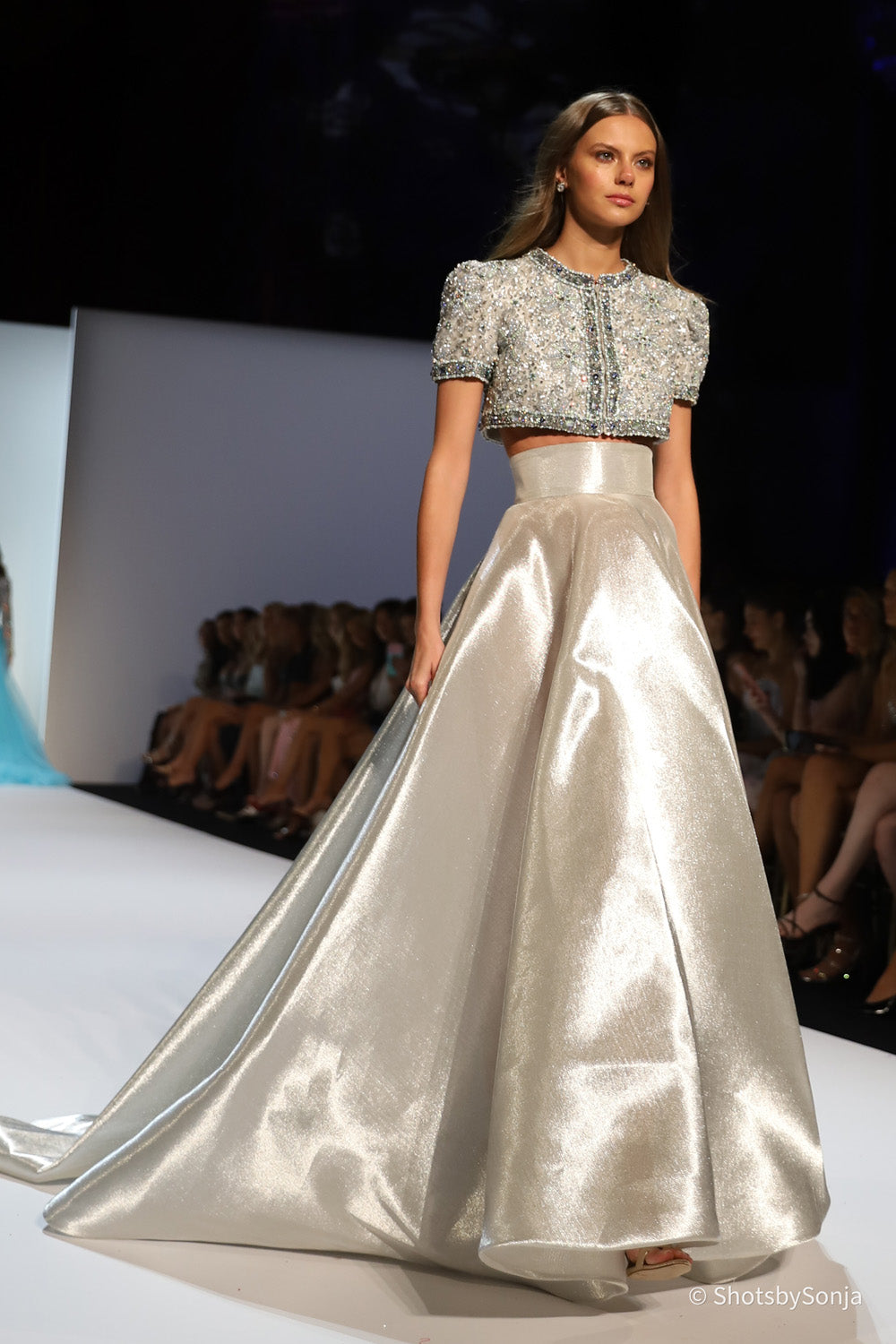 Sherri Hill 46780 silver couture two piece gown showing structured ball skirt and embellished bodice side angle