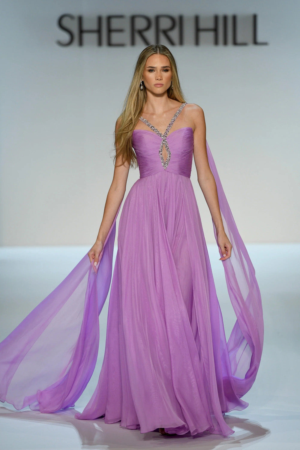Sherri Hill 58315 full-length violet ruched chiffon gown with beaded keyhole neckline and dramatic side panels