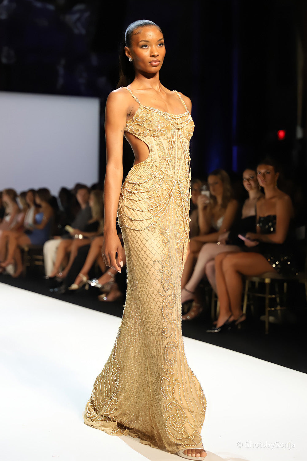 Sherri Hill 58445 nude gold beaded mermaid gown with scoop neckline, cascading bodice embellishment and open side cutout