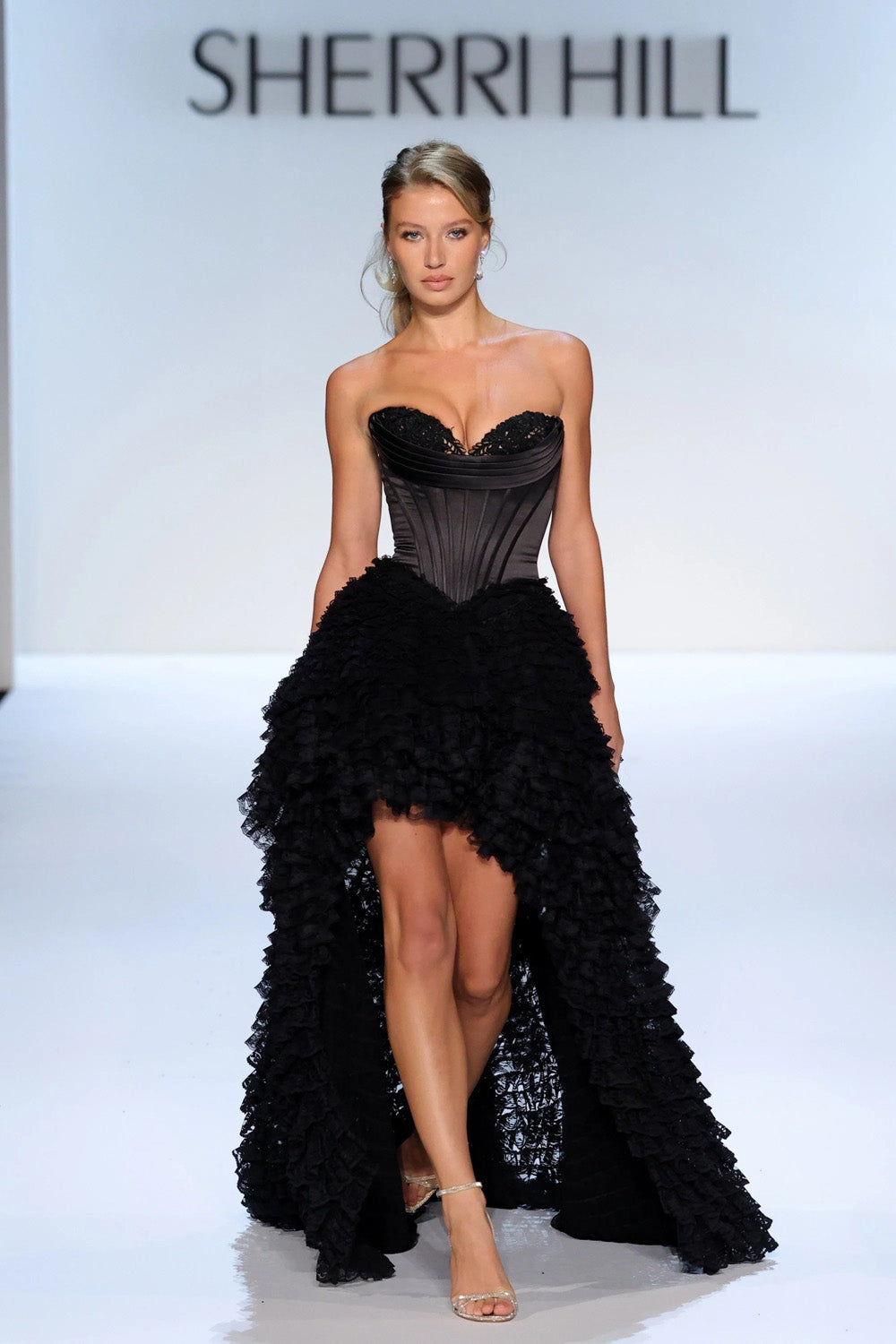 Sherri Hill 58577 black strapless corset prom gown with voluminous tiered ruffle high-low skirt