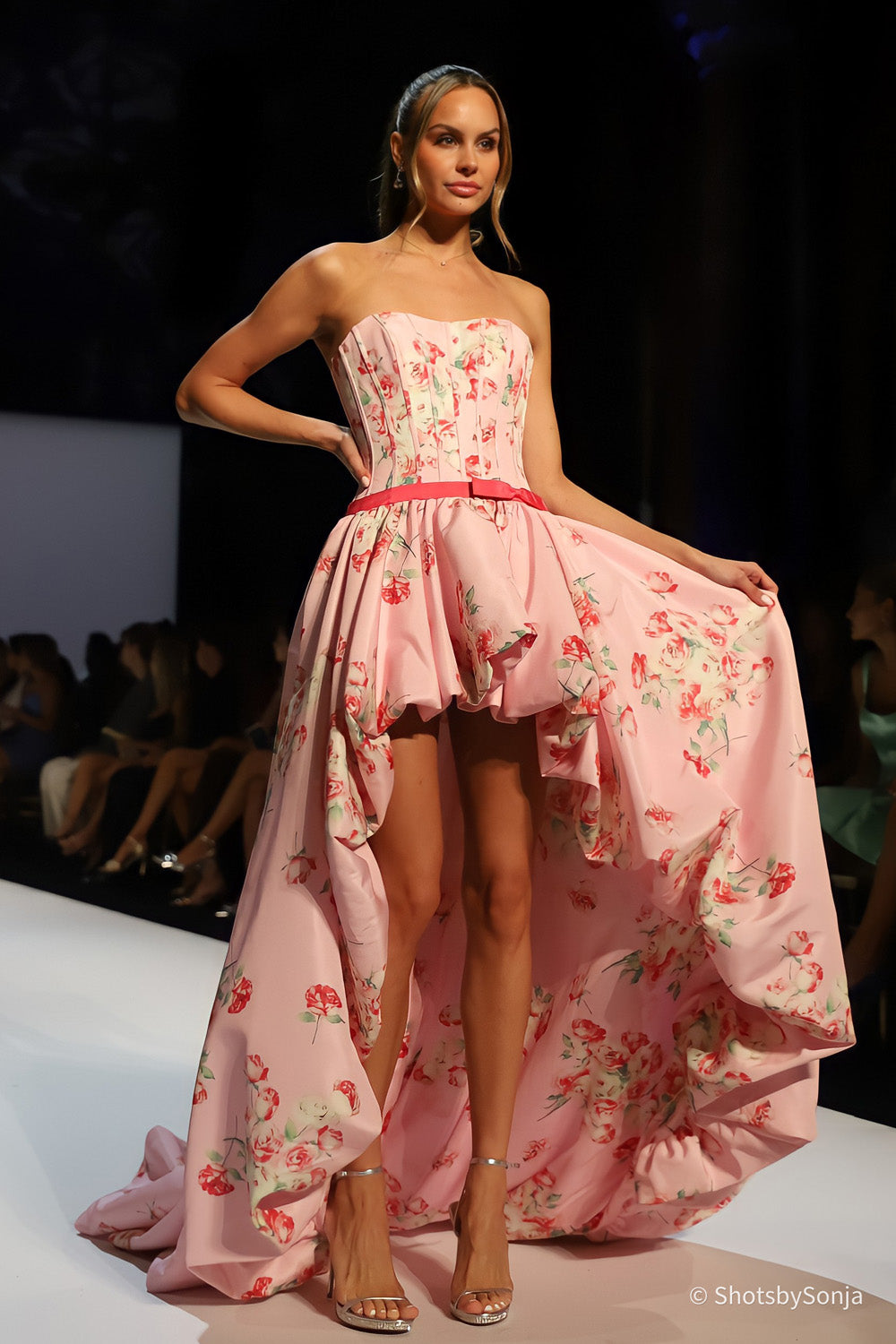 Sherri Hill 58652 pink print high-low floral gown with voluminous cascading skirt held to the side