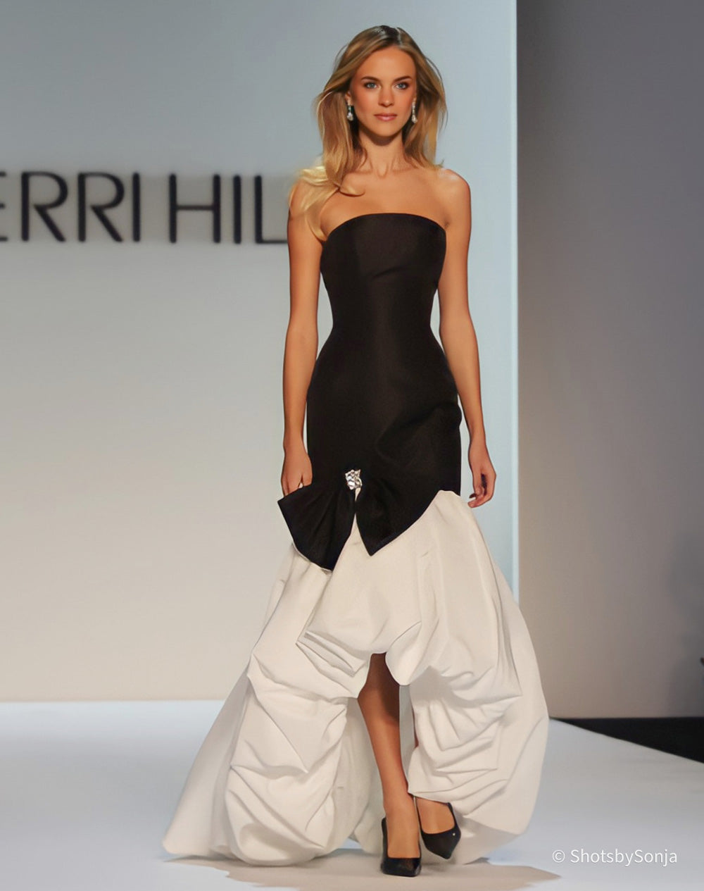 Sherri Hill 58707 black ivory strapless gown with bow detail and ruched ivory skirt full length front view