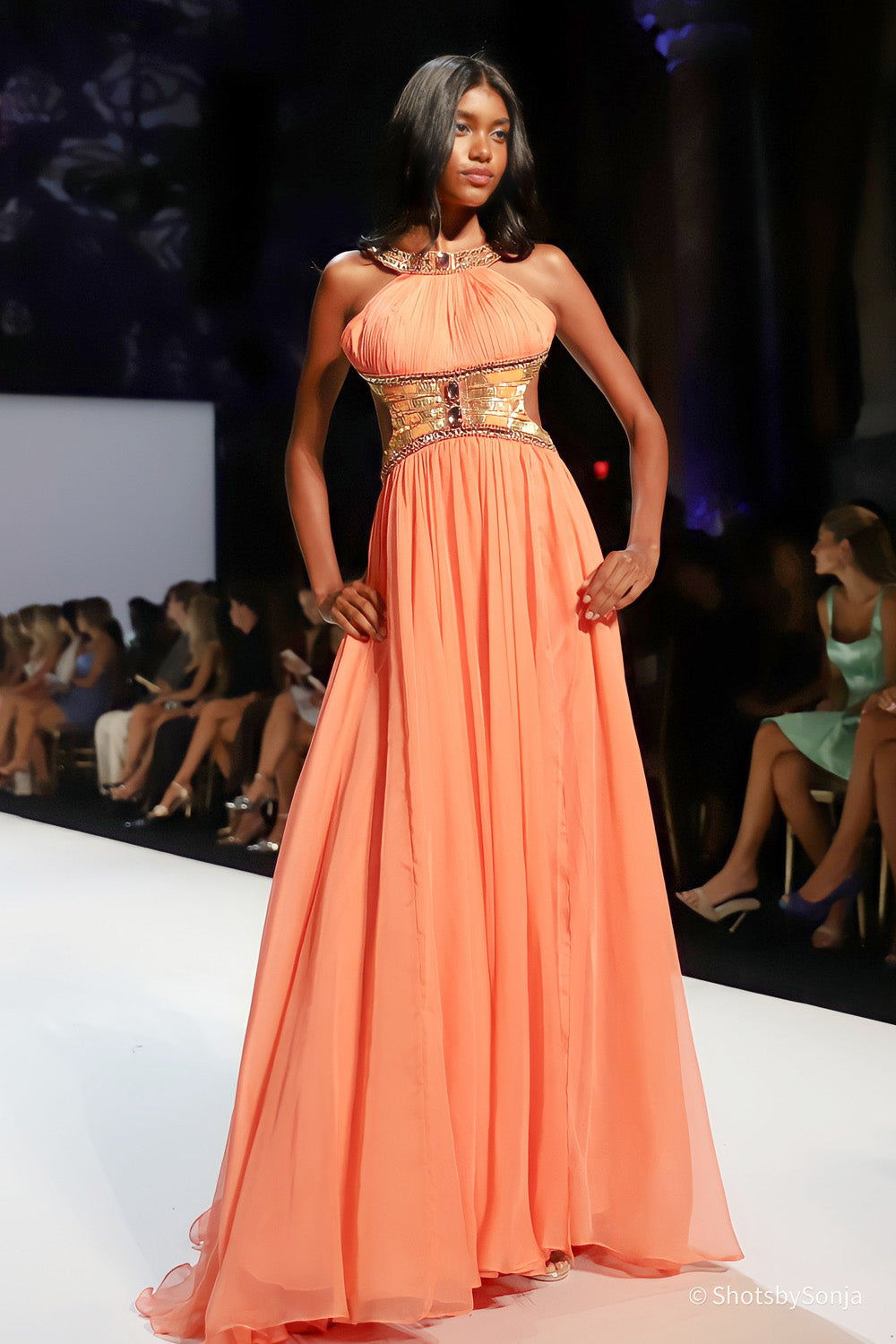 Sherri Hill 58740 coral gold floor length halter dress with wide geometric beaded waist band and full chiffon skirt