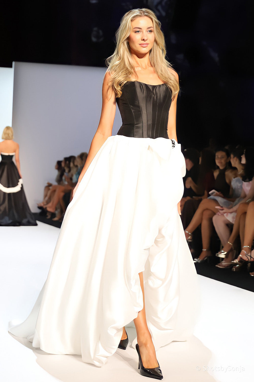 Sherri Hill 58768 black strapless corset bodice with ivory satin ballgown skirt and large hip bow embellishment
