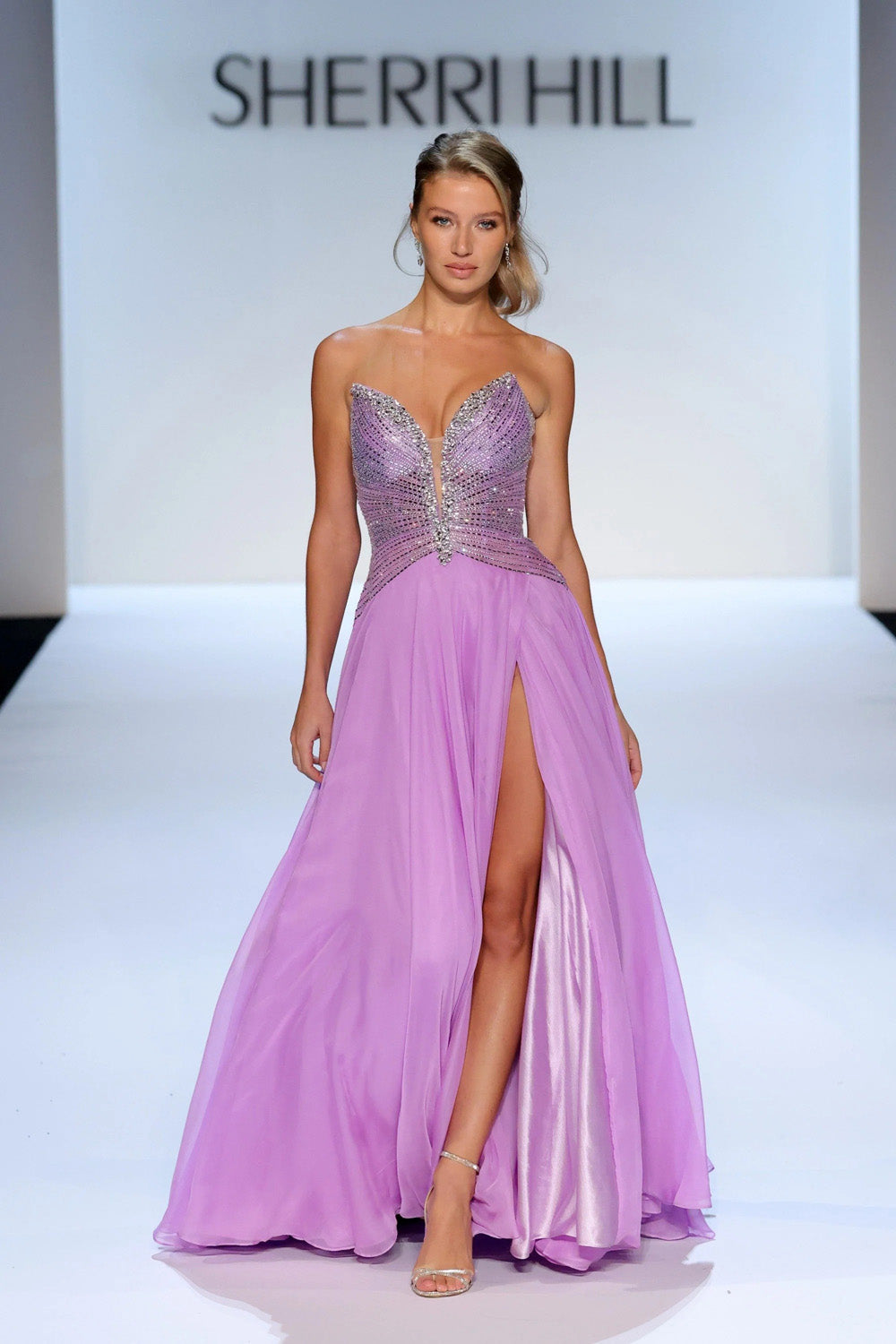 Sherri Hill 58833 orchid prom gown with heavily beaded bodice plunging centre panel and satin-lined chiffon skirt