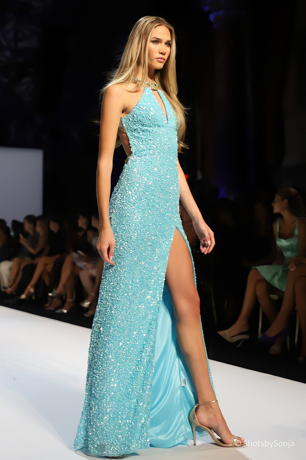 Sherri Hill 58878 aqua gold beaded halter gown with V keyhole neckline side cutouts and high front slit on runway
