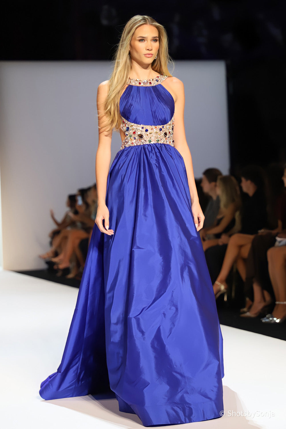 Sherri Hill 58905 bright royal blue halter ball gown with multicolor beaded waistband and full pleated skirt full length view