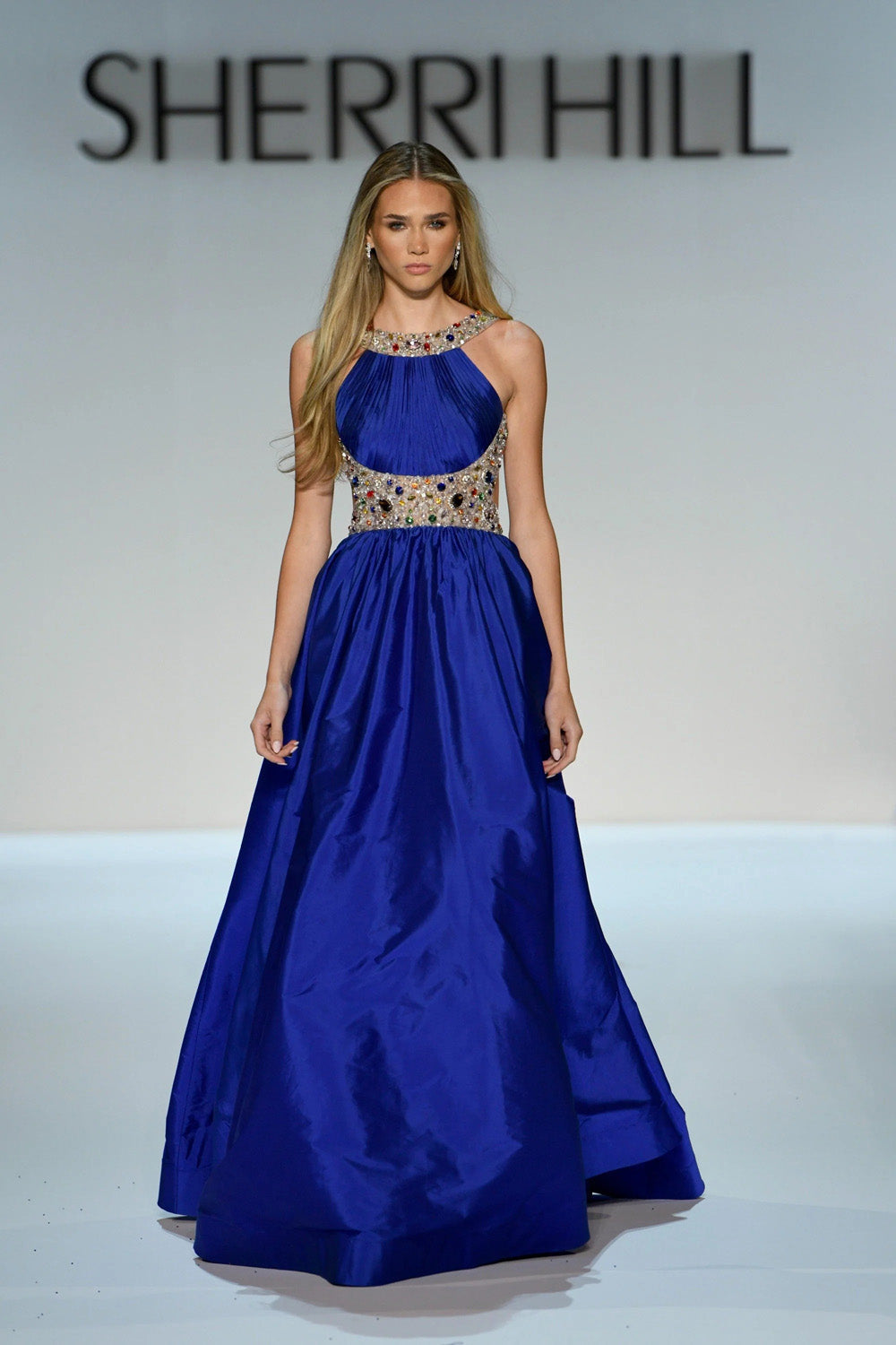 Sherri Hill 58905 bright royal blue ball gown with beaded halter neckline and waistband voluminous gathered skirt full length