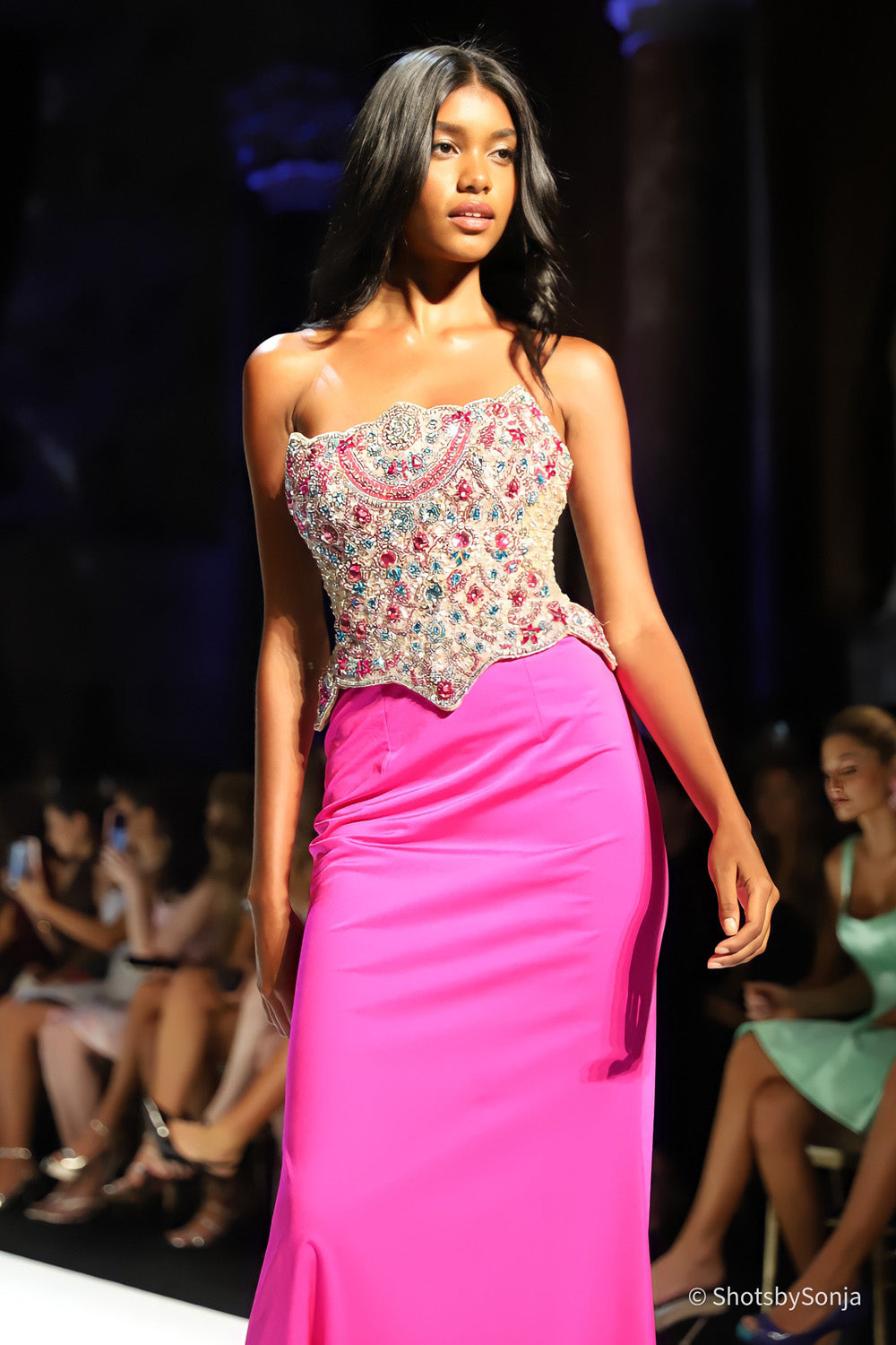Sherri Hill 58919 bright fuchsia multi strapless beaded corset bodice close up showing dense stone embellishment and scalloped waist edge