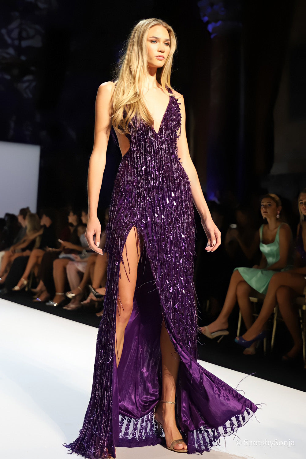 Sherri Hill 58938 purple beaded fringe gown with deep V neckline open back and high front slit on runway