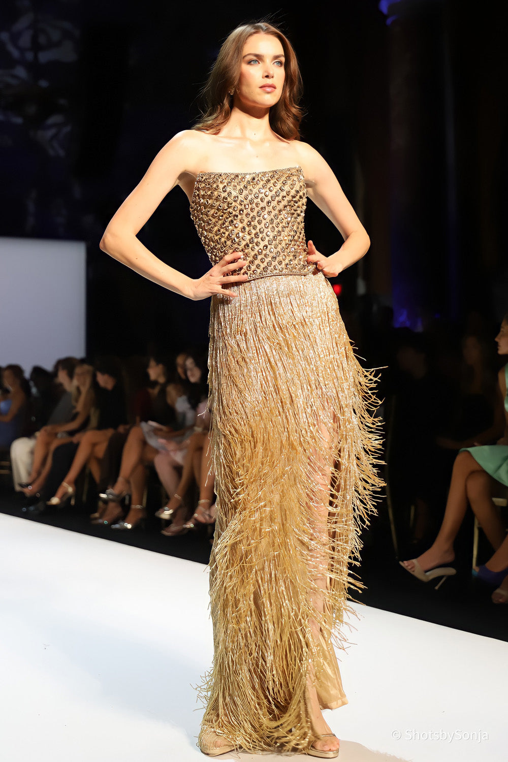 Sherri Hill 67236 gold embellished bodice with geometric stone grid and tiered floor length fringe skirt full view