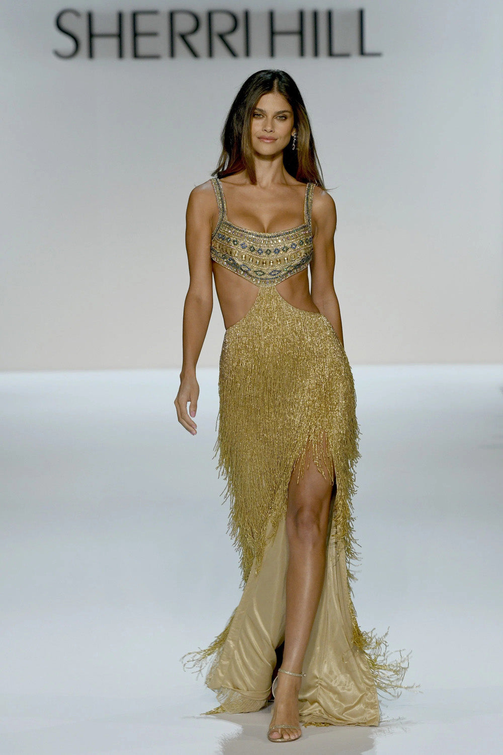 Sherri Hill 67307 gold blue zircon capri blue shadow beaded bustier cutout gown with floor length metallic fringe skirt
