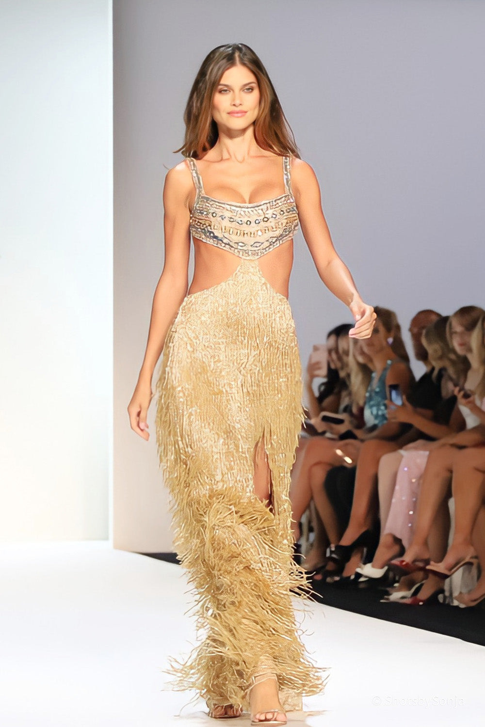 Sherri Hill 67307 gold beaded bustier bodice with cutout waist and full length tiered metallic fringe skirt front view