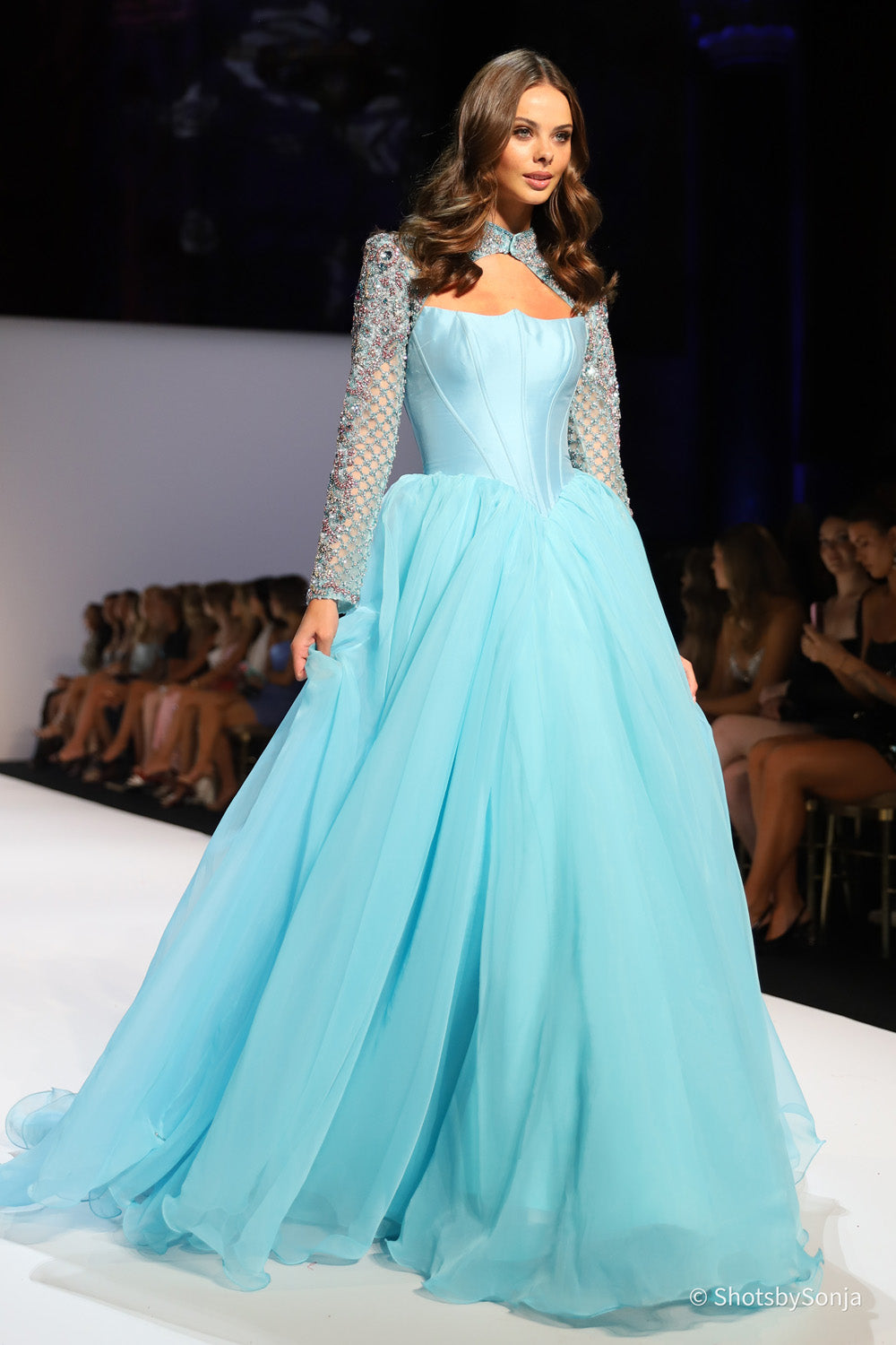 Sherri Hill 67345 aqua ballgown with beaded long sleeves corset bodice and full chiffon skirt front view