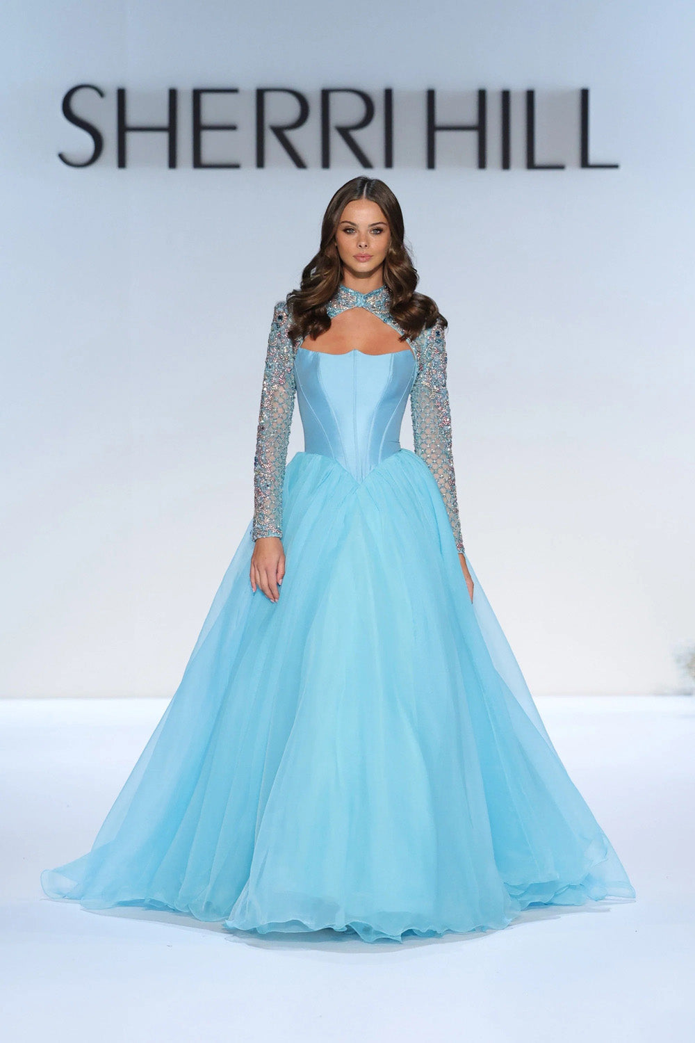 Sherri Hill 67345 aqua ballgown with beaded long sleeves crossover halter neckline and full chiffon skirt