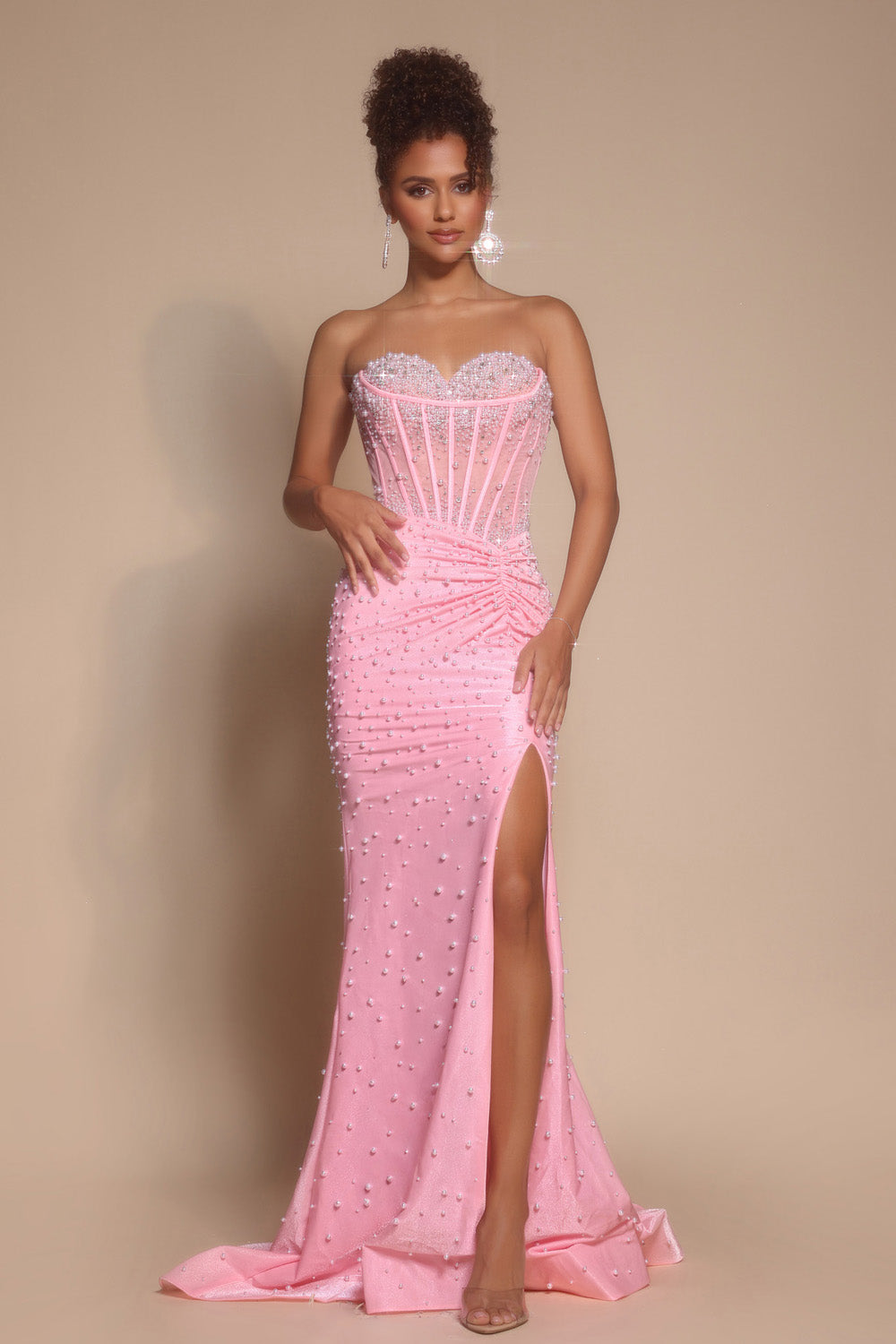 Portia and Scarlett PS26002 Pink mermaid prom dress with beading and a thigh-high slit, front view.