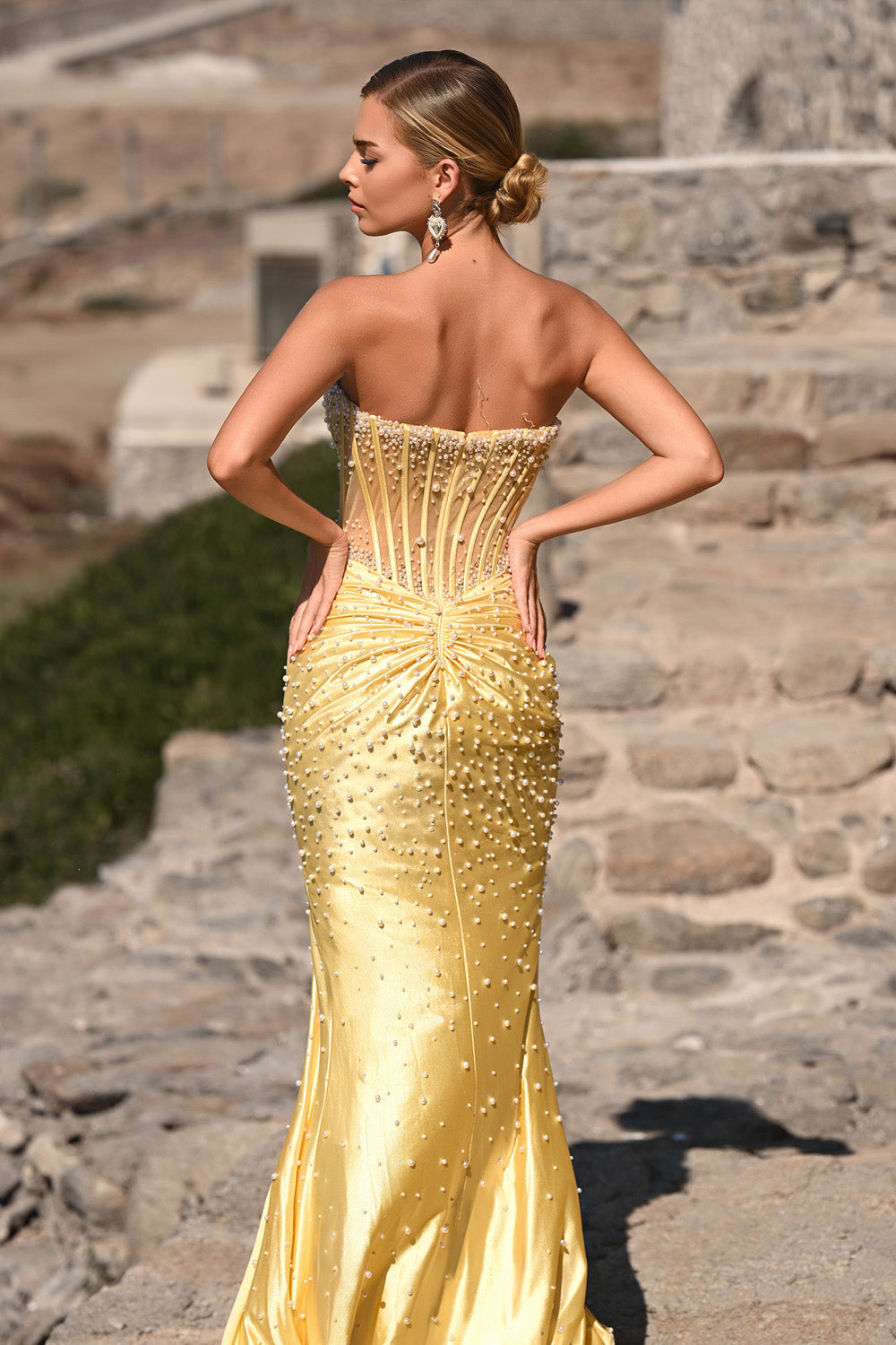 Portia and Scarlett PS26002 Yellow mermaid prom dress with beaded detailing, featuring a corset back.