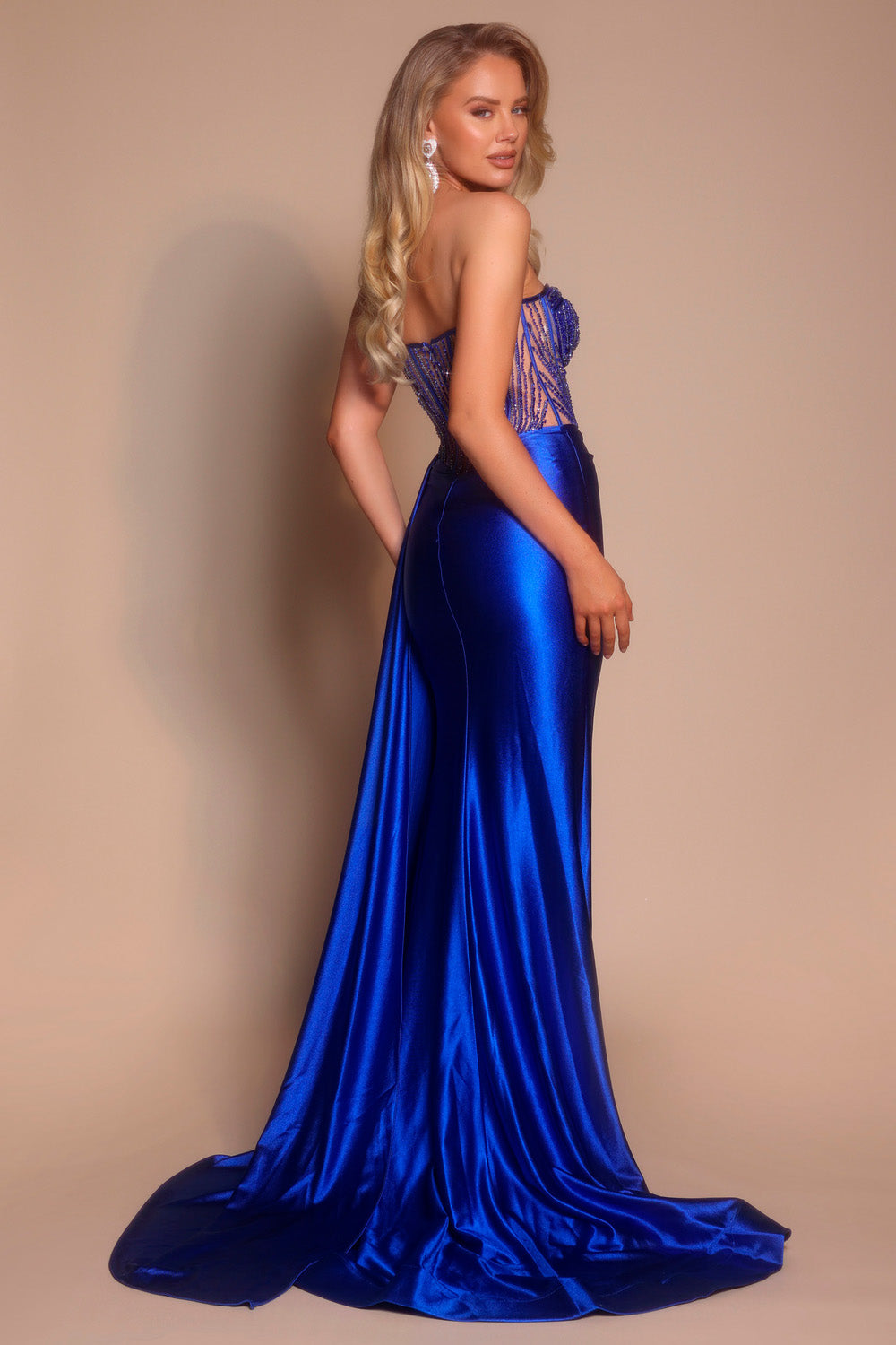 Portia and Scarlett PS26056 Cobalt mermaid prom dress with beaded corset and elegant train, side view.