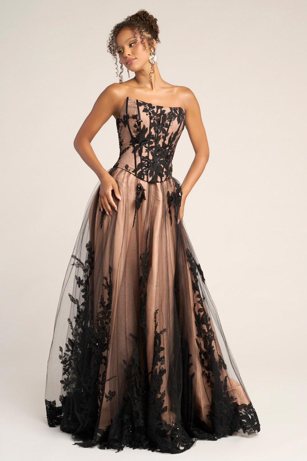 Portia and Scarlett PS26061 Black nude prom dress with floral lace detailing and a fitted bodice, front view.