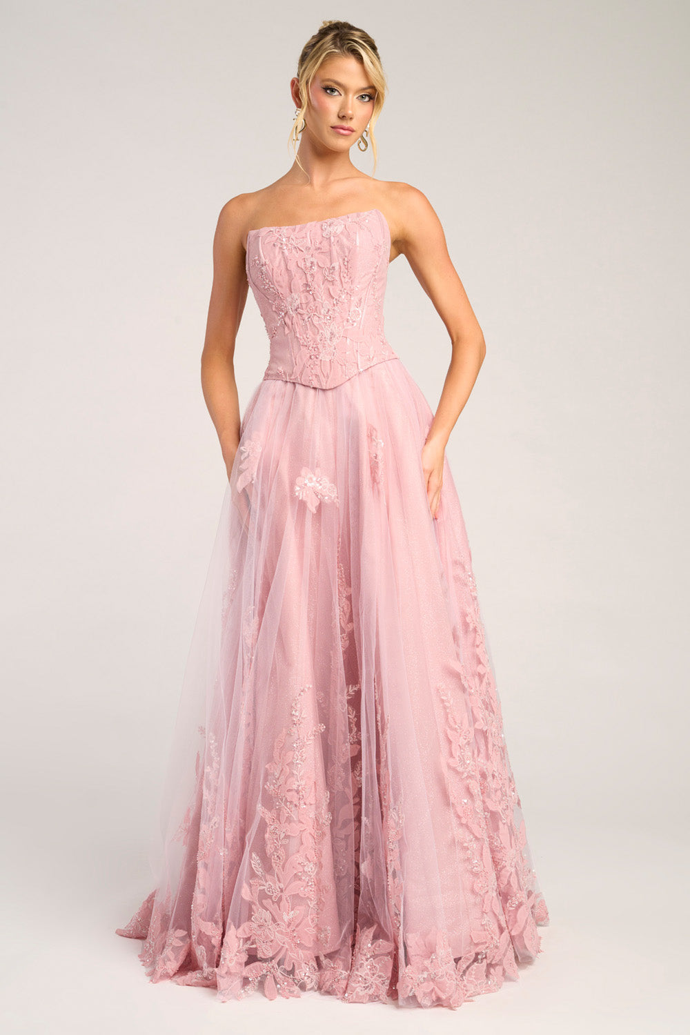 Portia and Scarlett PS26061 Pink A-line prom dress with intricate floral embroidery and a strapless design.